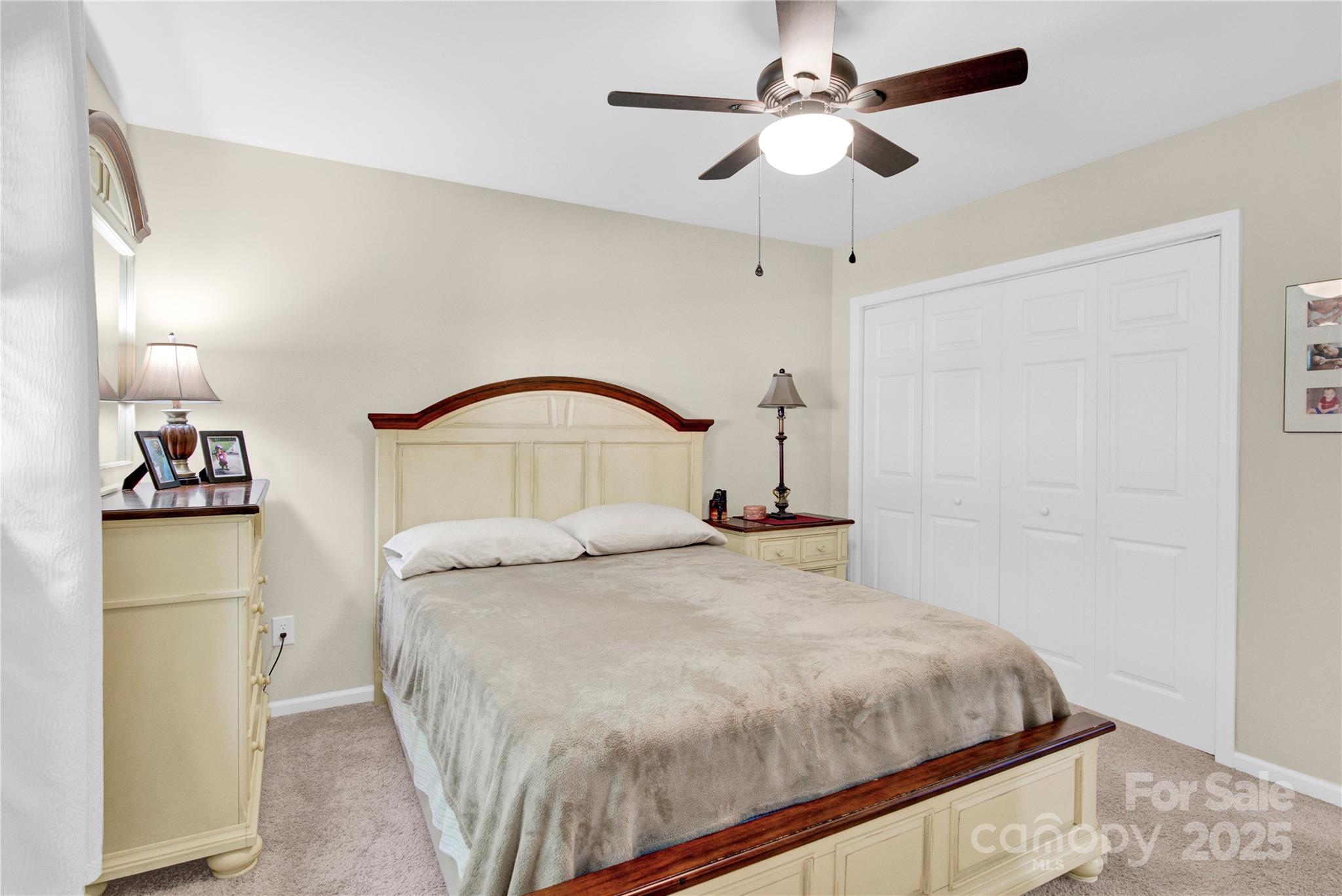 159 Bowman Road Statesville, NC 28625 - Photo 16 of 38 a bedroom with a bed and a chandelier