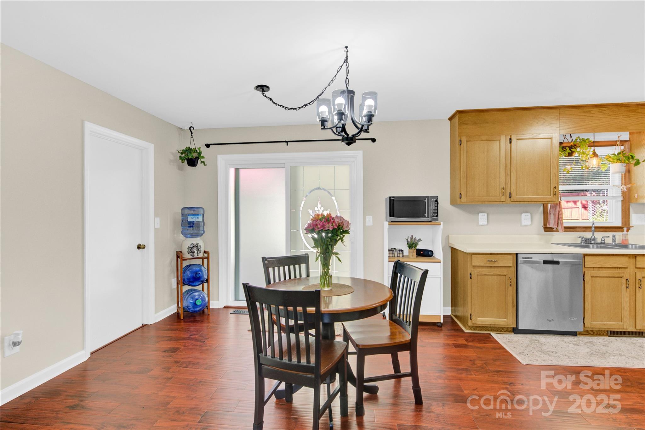 159 Bowman Road Statesville, NC 28625 - Photo 19 of 38 a view of a dining room with furniture and wooden floor