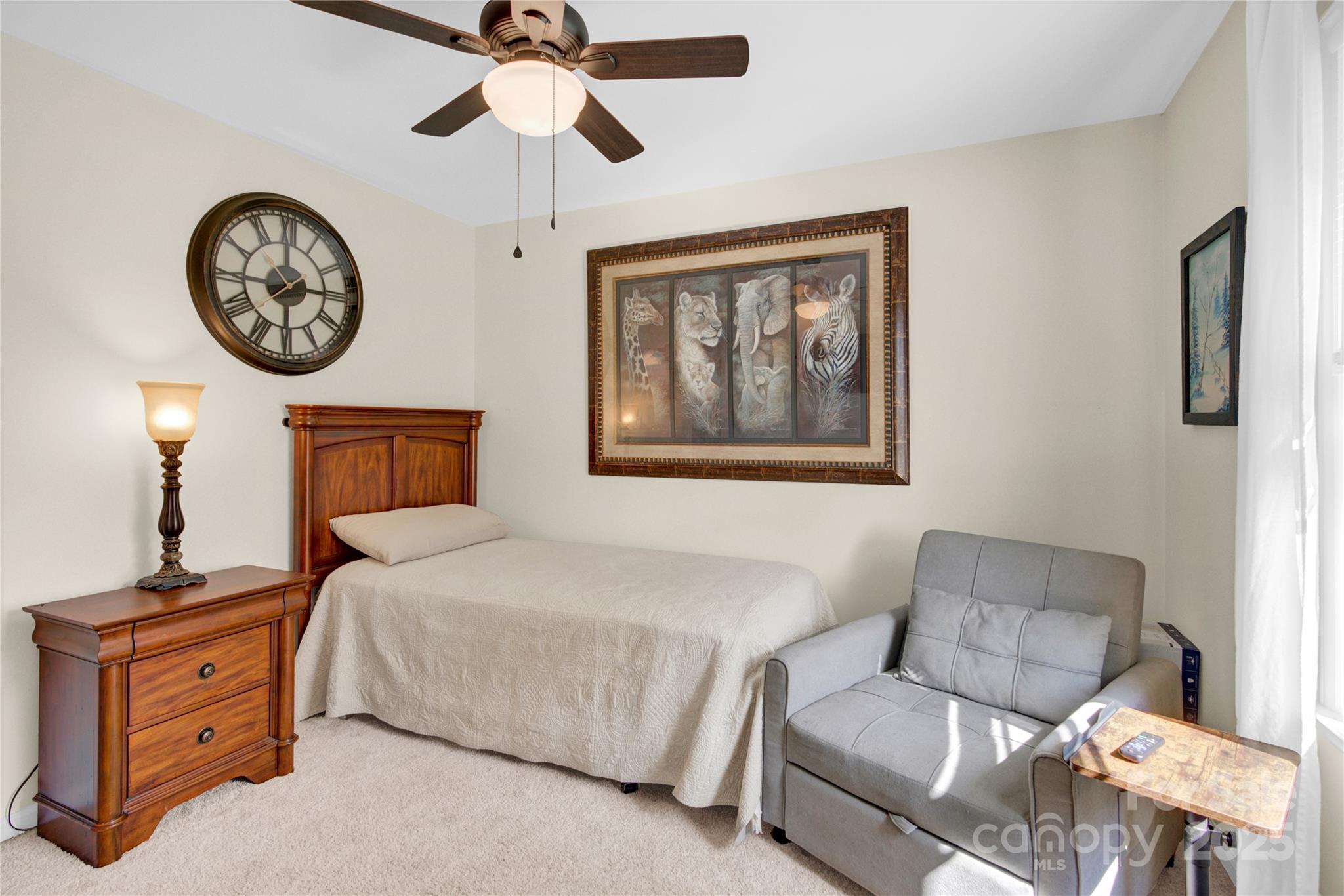 159 Bowman Road Statesville, NC 28625 - Photo 21 of 38 a bedroom with a bed and a lamp on the dresser