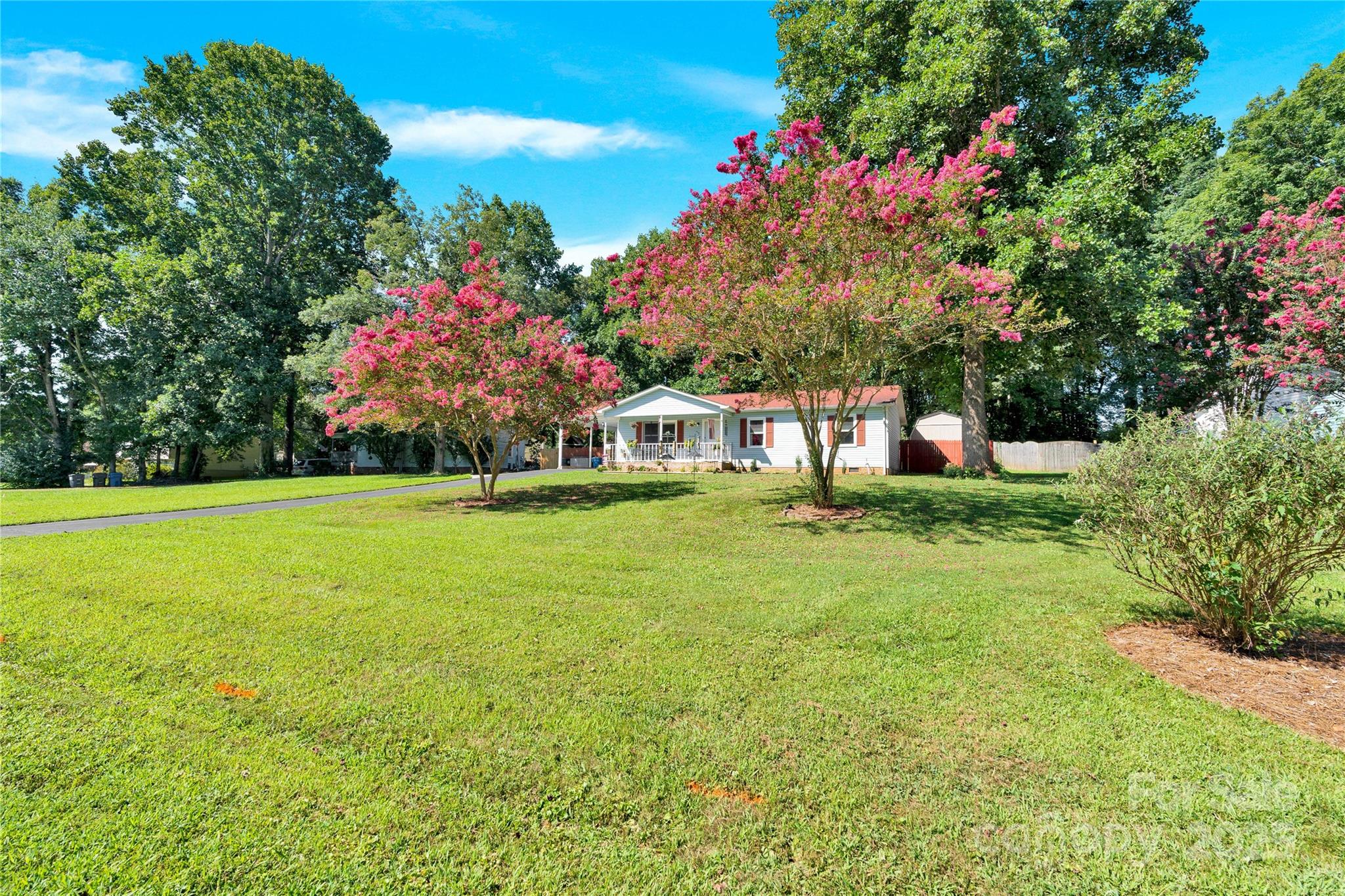 159 Bowman Road Statesville, NC 28625 - Photo 24 of 38 a view of a house with a big yard and large trees