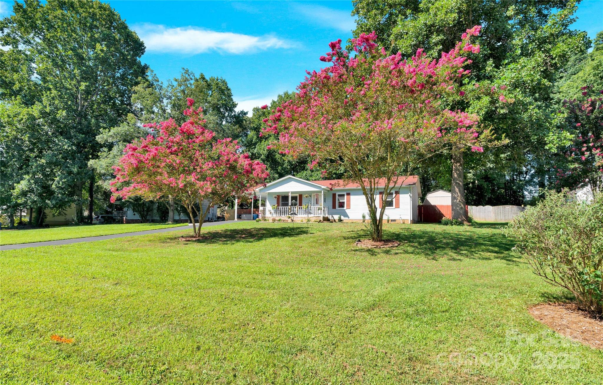 159 Bowman Road Statesville, NC 28625 - Photo 25 of 38 a small garden covered with tall trees