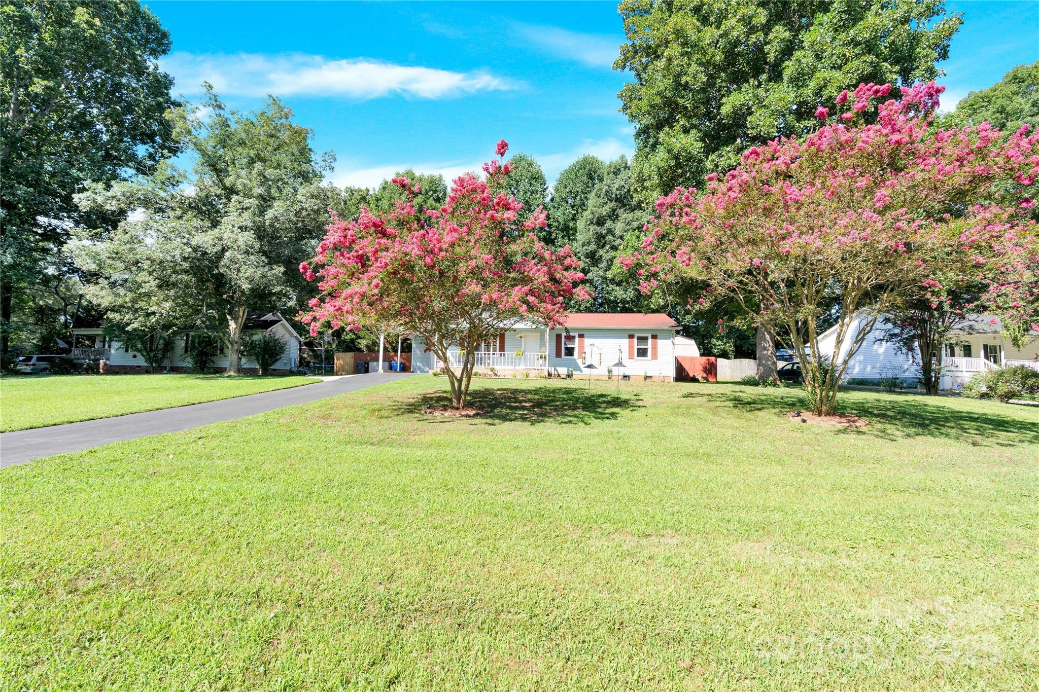 159 Bowman Road Statesville, NC 28625 - Photo 28 of 38 a front view of house with yard and seating area