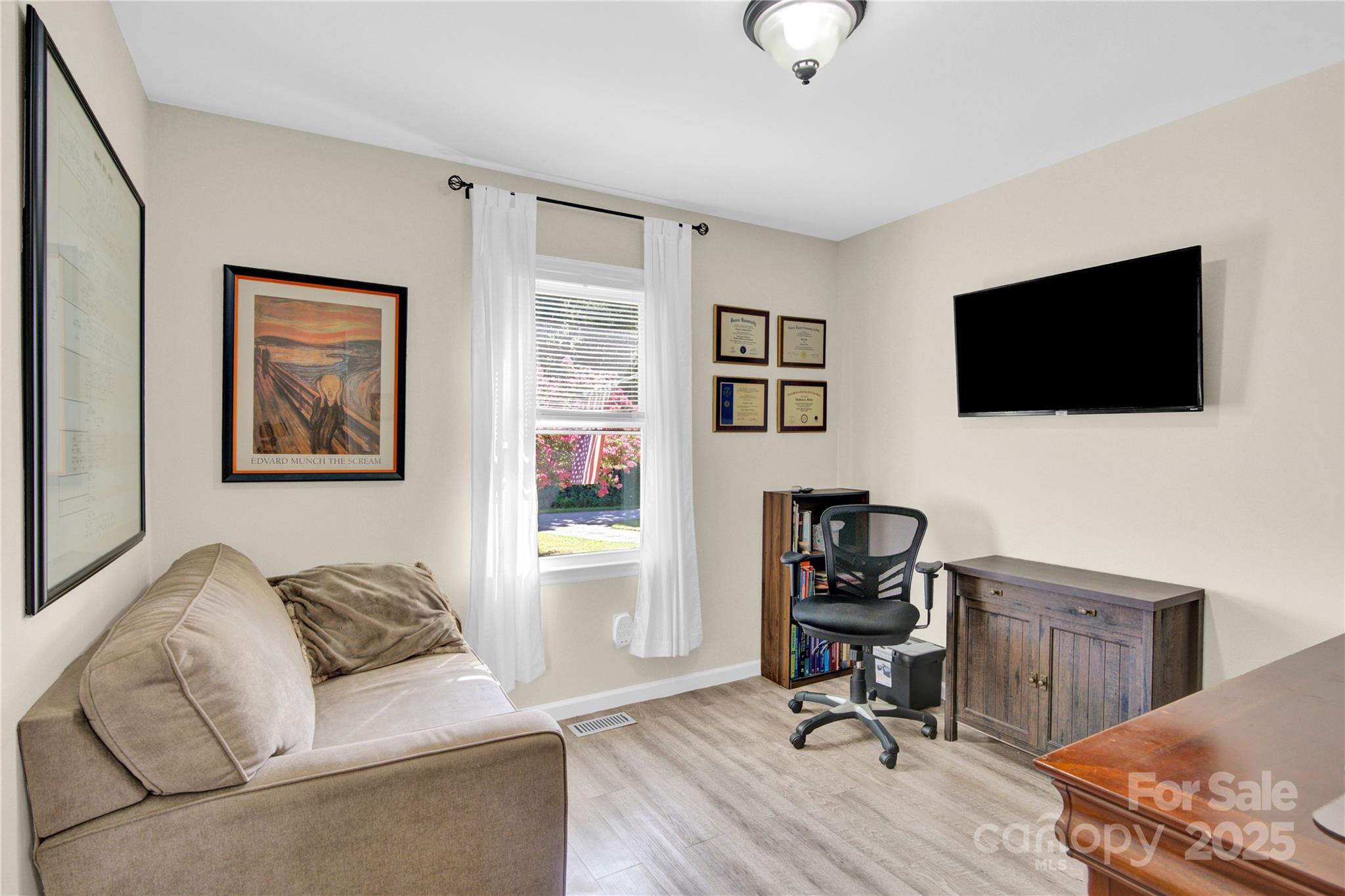 159 Bowman Road Statesville, NC 28625 - Photo 5 of 38 a living room with furniture and a flat screen tv