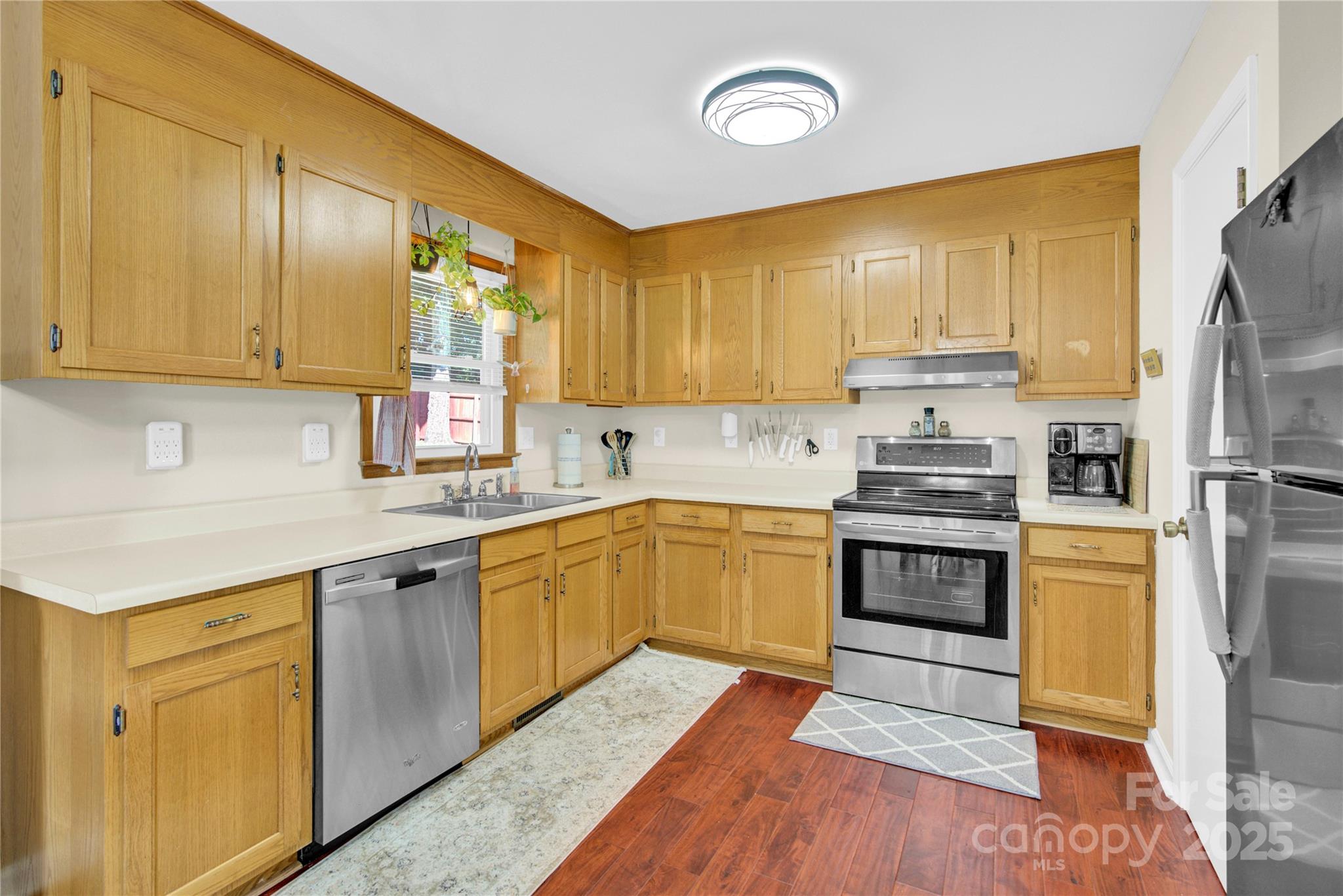 159 Bowman Road Statesville, NC 28625 - Photo 6 of 38 a kitchen with stainless steel appliances granite countertop a sink refrigerator stove and microwave