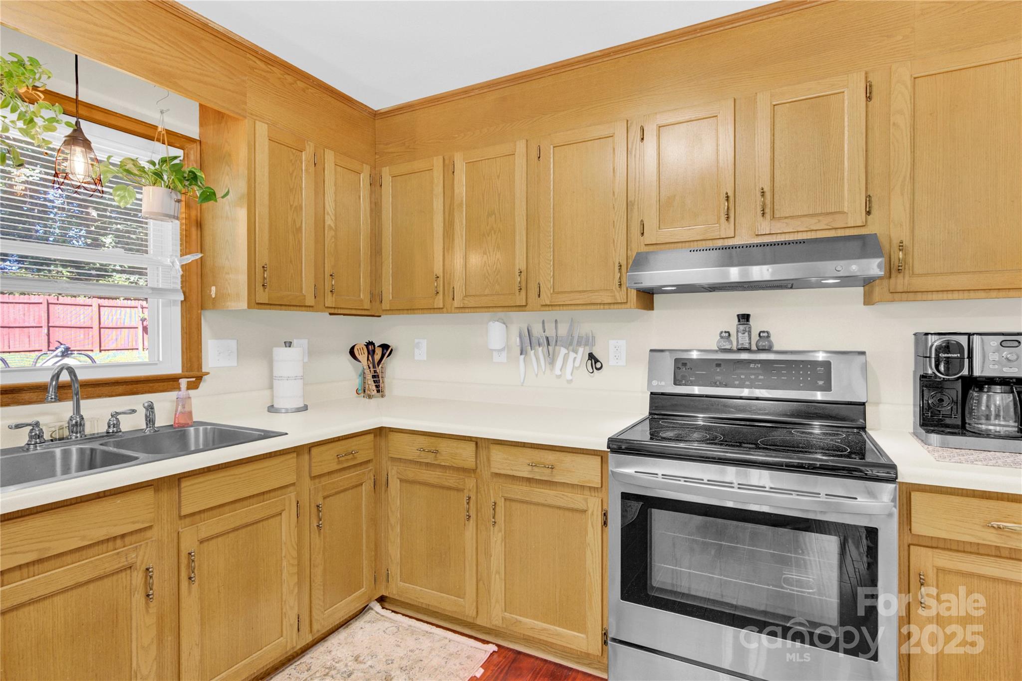 159 Bowman Road Statesville, NC 28625 - Photo 8 of 38 a kitchen with stainless steel appliances granite countertop a sink a stove and a microwave