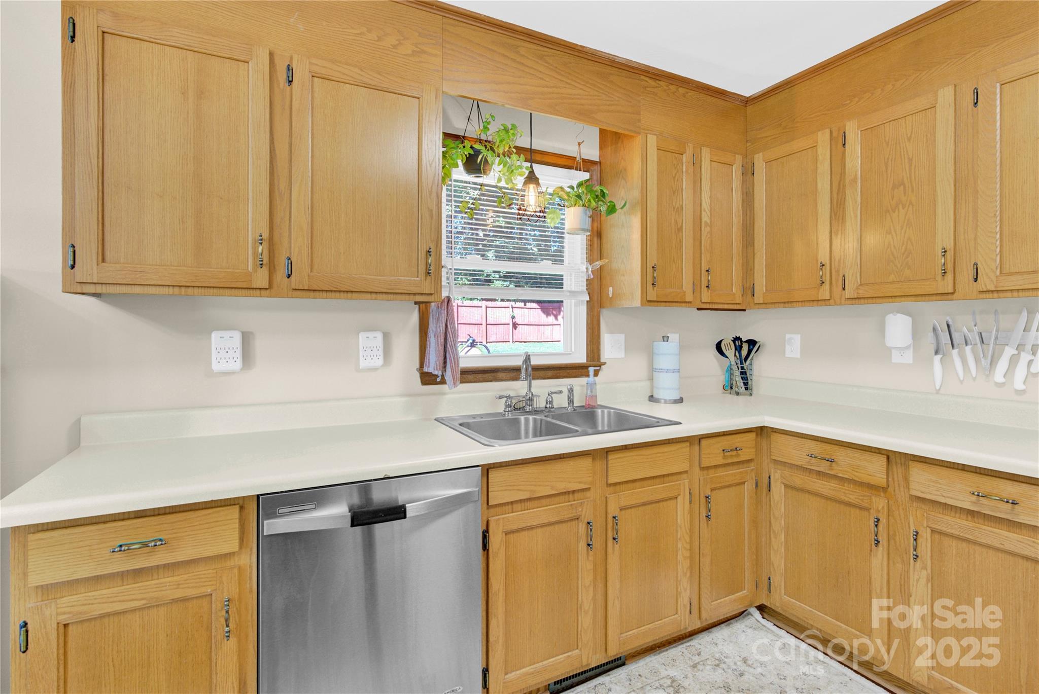 159 Bowman Road Statesville, NC 28625 - Photo 9 of 38 a kitchen with a sink cabinets and window