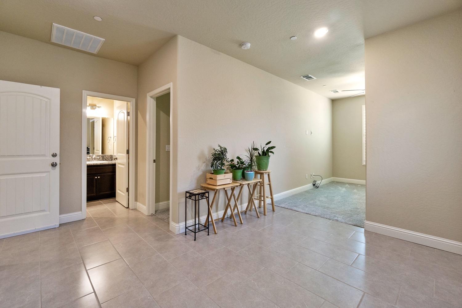 881 Strada Street Lemoore, CA 93245 - Photo 23 of 39 NextGen Dining/Living/Bathroom