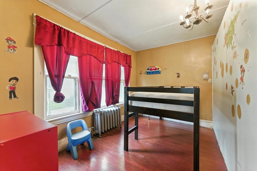 18-20 Eldridge Street Springfield, MA 01108 - Photo 12 of 42 a view of a room with wooden floor and lounge chair