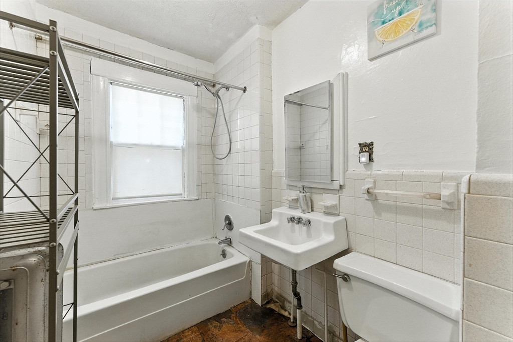 18-20 Eldridge Street Springfield, MA 01108 - Photo 15 of 42 a bathroom with a sink toilet and shower