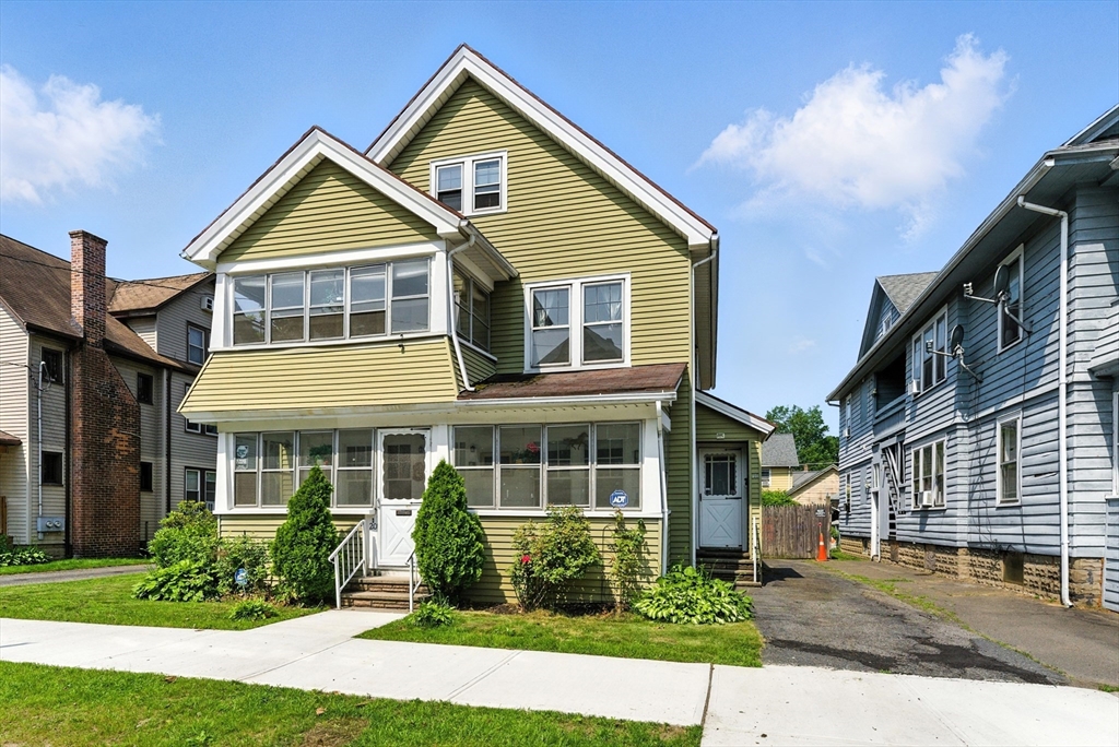 18-20 Eldridge Street Springfield, MA 01108 - Photo 2 of 42 a front view of a house with a yard