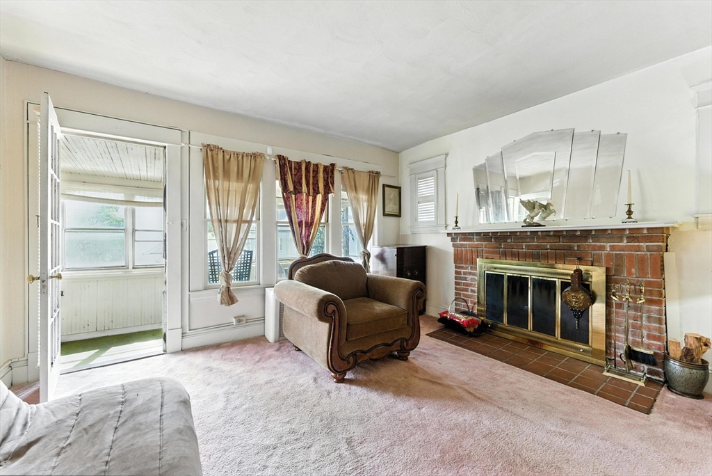 18-20 Eldridge Street Springfield, MA 01108 - Photo 22 of 42 a living room with furniture and a fireplace
