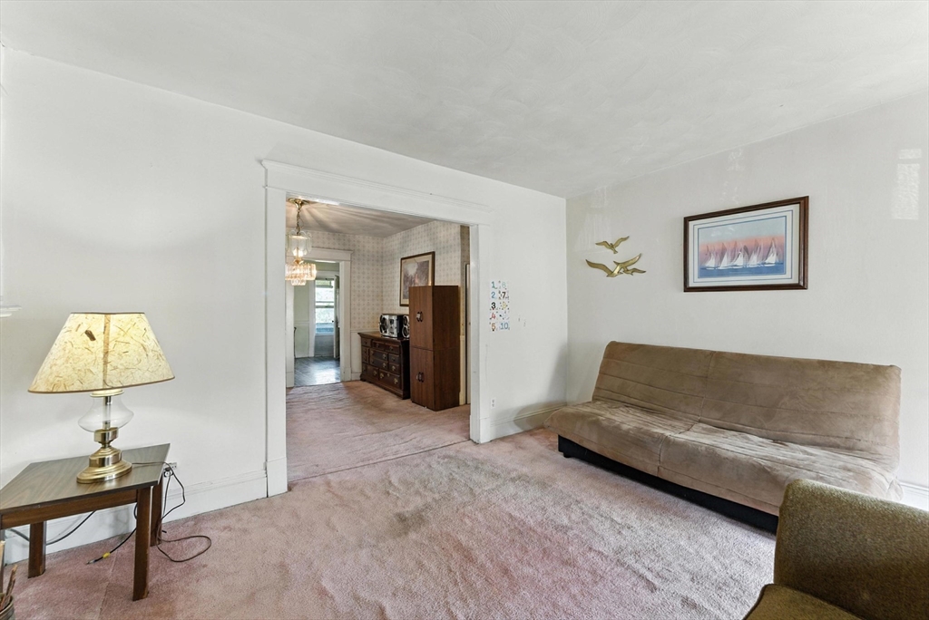 18-20 Eldridge Street Springfield, MA 01108 - Photo 24 of 42 a living room with furniture and a lamp