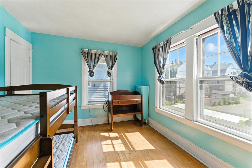 18-20 Eldridge Street Springfield, MA 01108 - Photo 27 of 42 a bedroom with furniture and a window