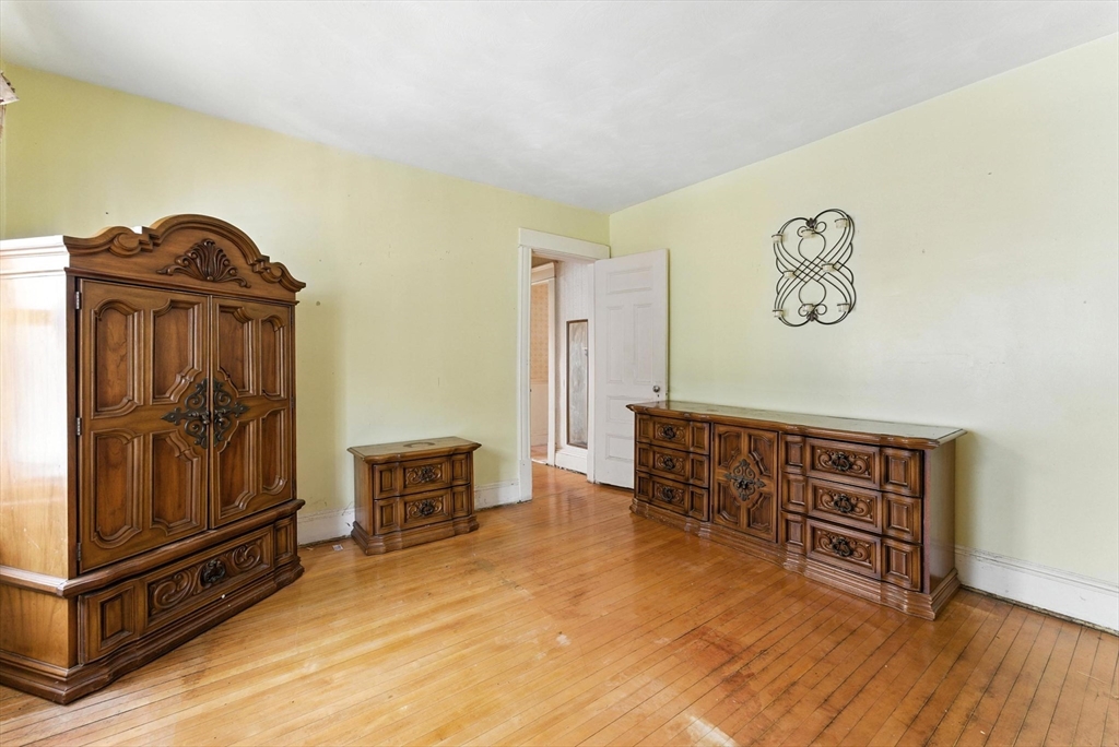 18-20 Eldridge Street Springfield, MA 01108 - Photo 32 of 42 a view of livingroom with furniture and wooden floor