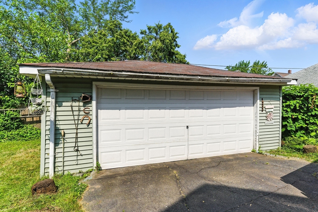 18-20 Eldridge Street Springfield, MA 01108 - Photo 39 of 42 a small white house with a outdoor space