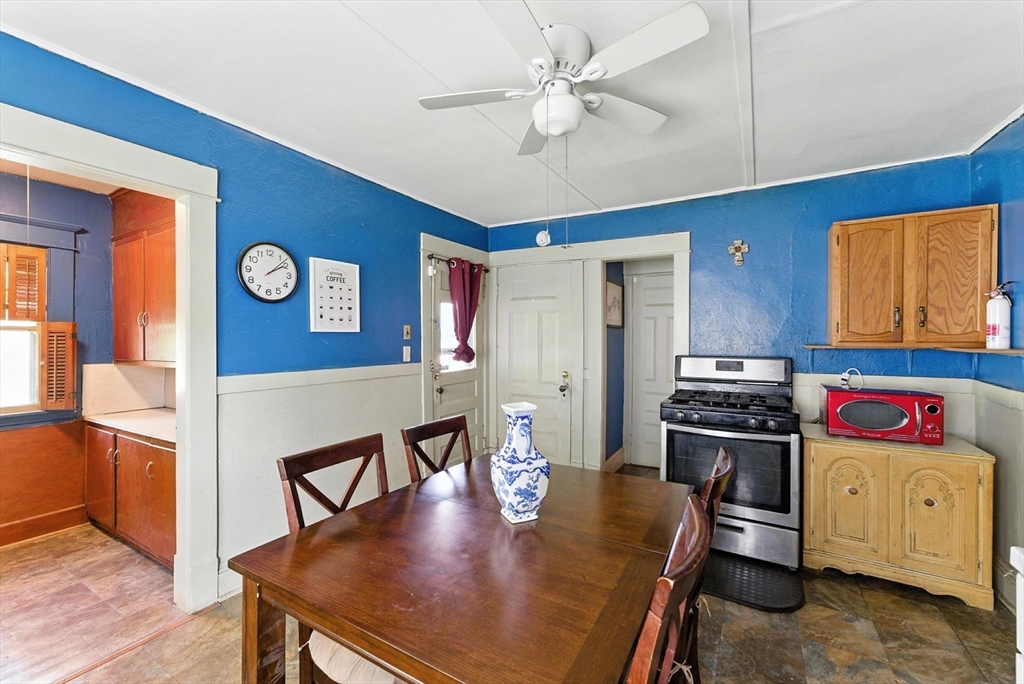 18-20 Eldridge Street Springfield, MA 01108 - Photo 4 of 42 a view of a dining room with furniture and wooden floor