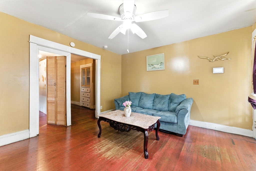 18-20 Eldridge Street Springfield, MA 01108 - Photo 9 of 42 a living room with furniture and a wooden floor