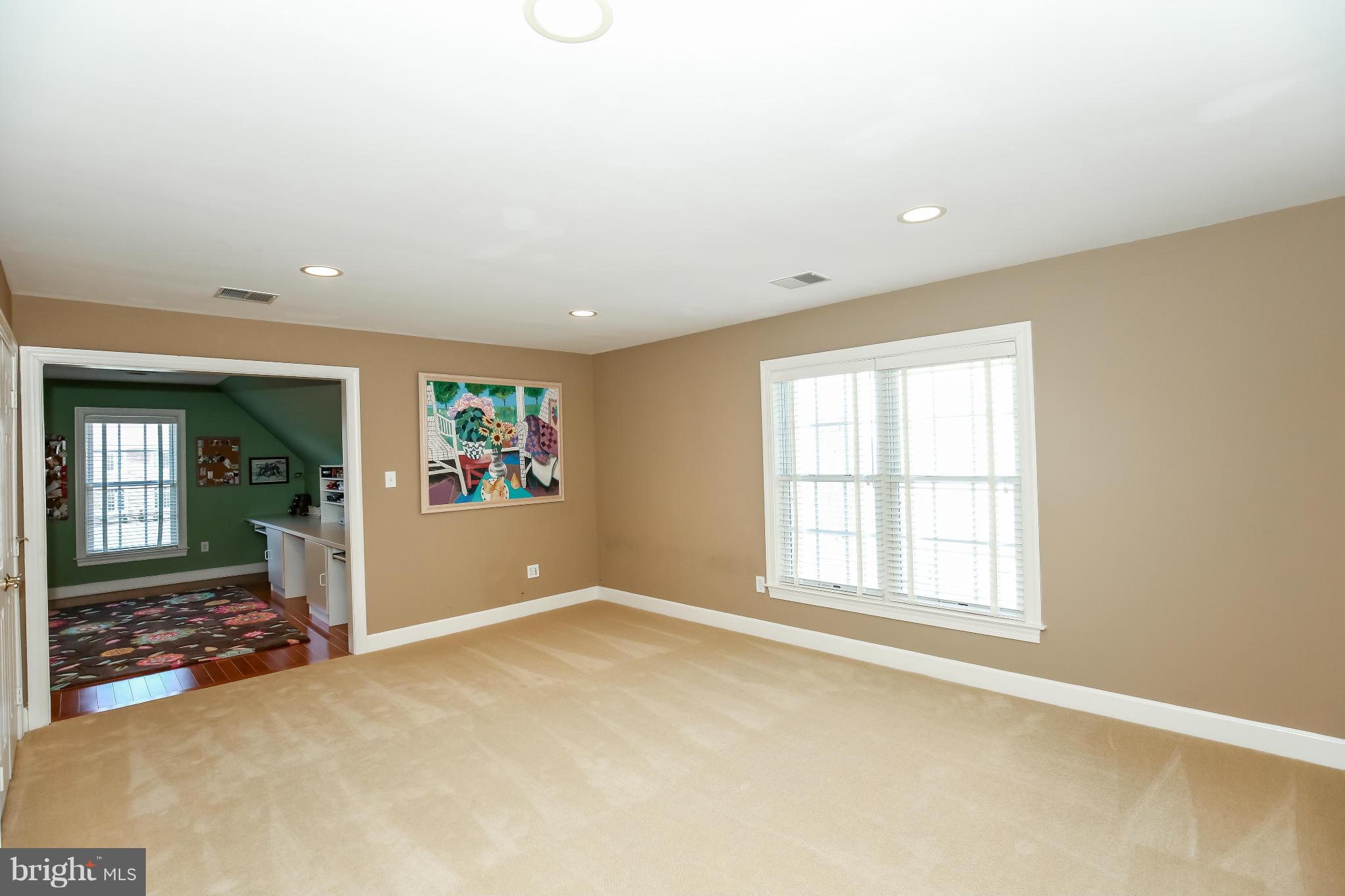 10403 Grey Fox Road Potomac, MD 20854 - Photo 17 of 23 an empty room with entrance and windows