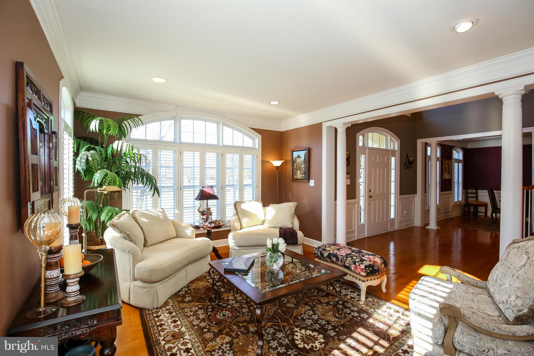 10403 Grey Fox Road Potomac, MD 20854 - Photo 3 of 23 a living room with furniture and a large window