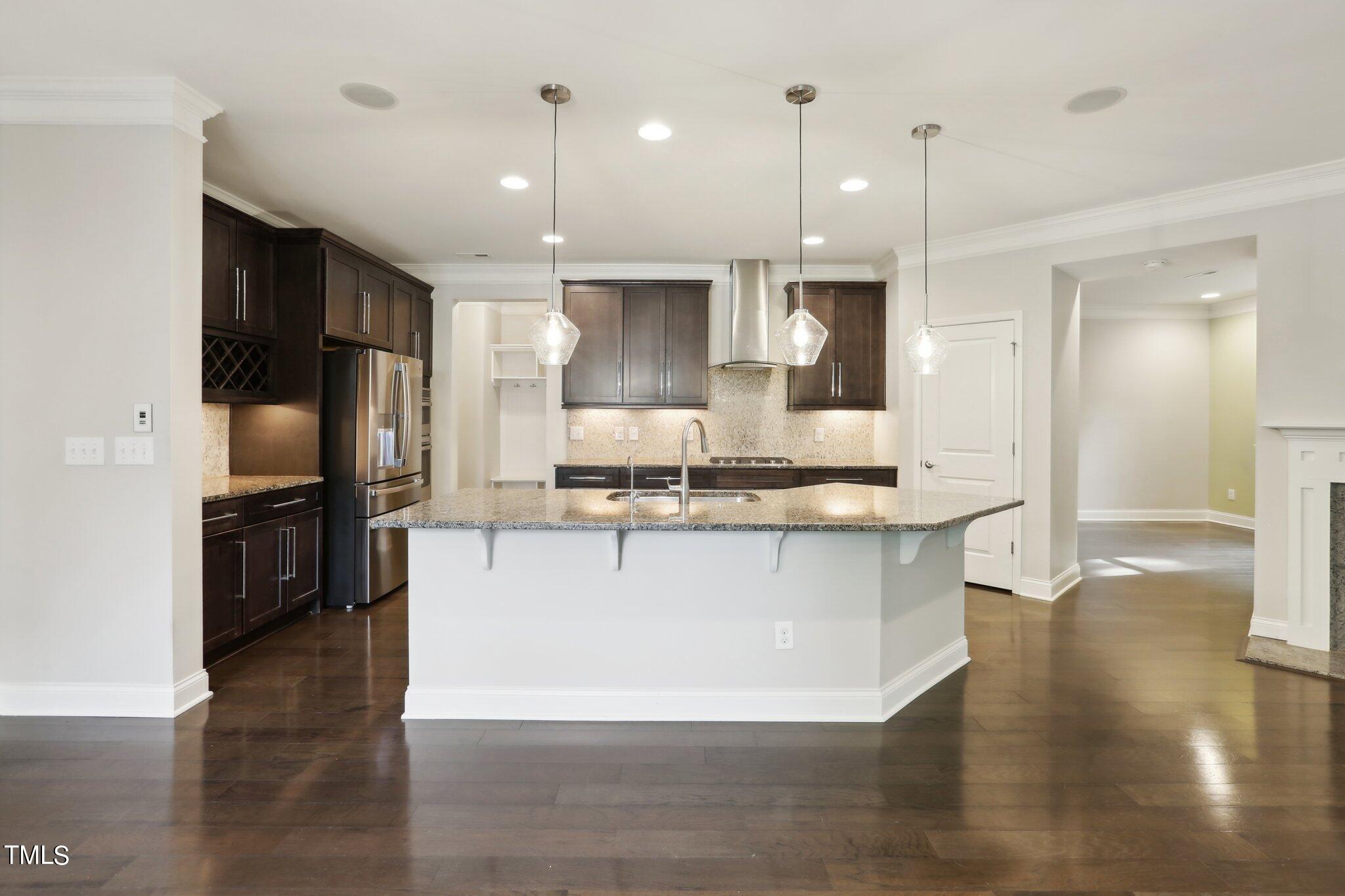 517 Plainview Avenue Raleigh, NC 27604 - Photo 12 of 58 a large kitchen with stainless steel appliances kitchen island a large counter top and stove