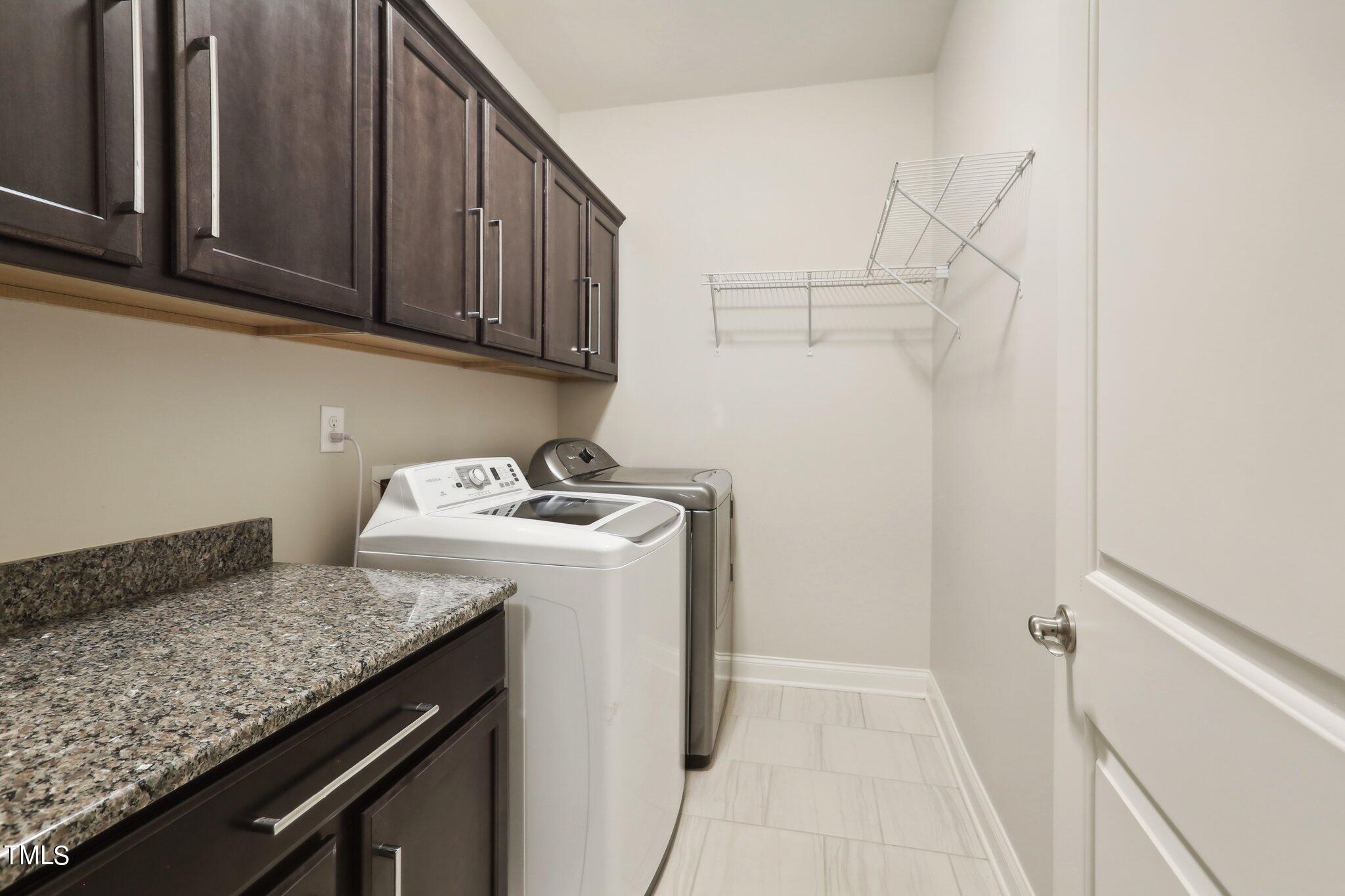 517 Plainview Avenue Raleigh, NC 27604 - Photo 23 of 58 a utility room with granite countertop cabinets washer and dryer