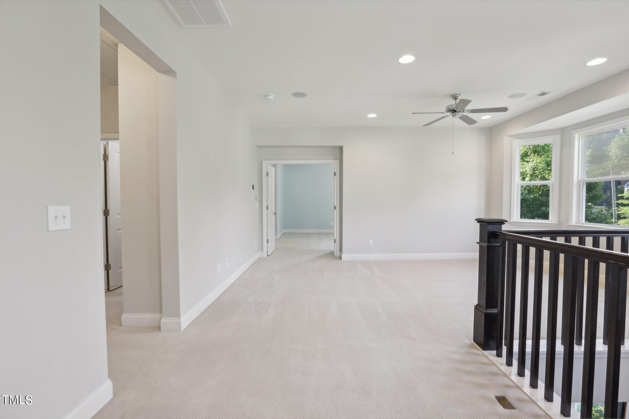 517 Plainview Avenue Raleigh, NC 27604 - Photo 28 of 58 en empty room with windows and ceiling fan