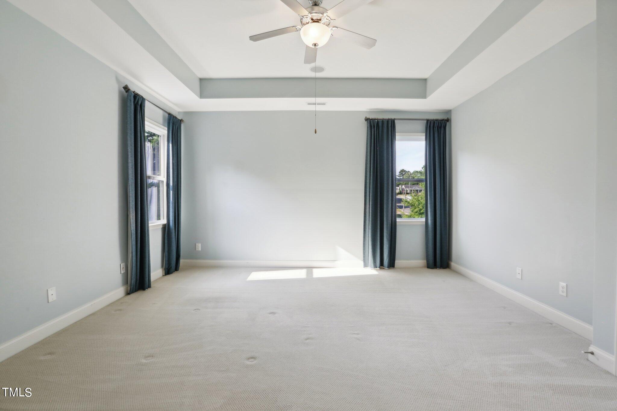 517 Plainview Avenue Raleigh, NC 27604 - Photo 35 of 58 a view of an empty room with a ceiling fan