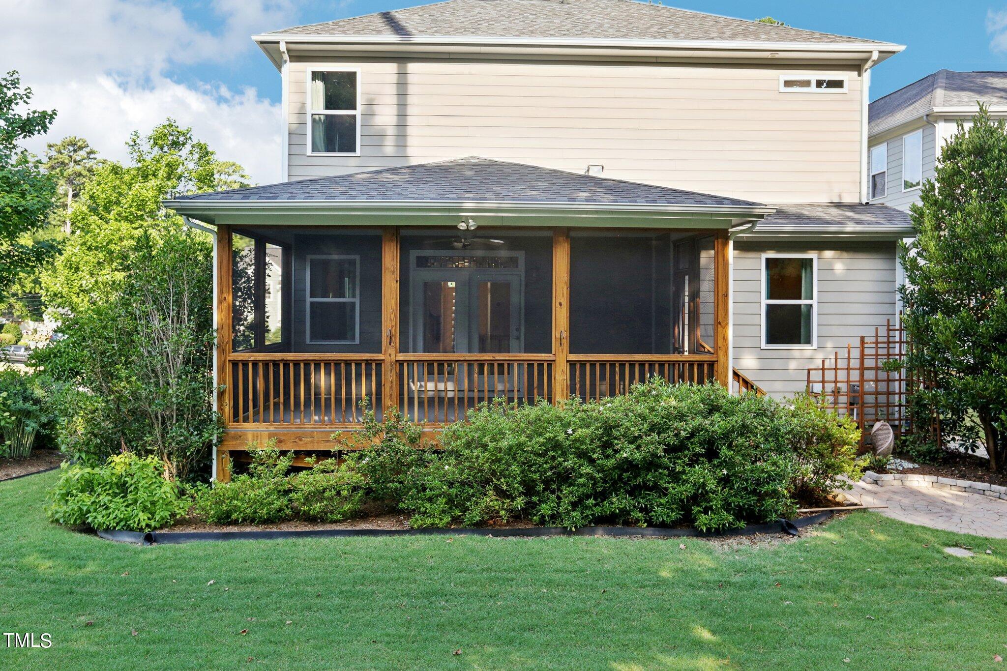 517 Plainview Avenue Raleigh, NC 27604 - Photo 46 of 58 a view of a house with brick walls and a yard with plants