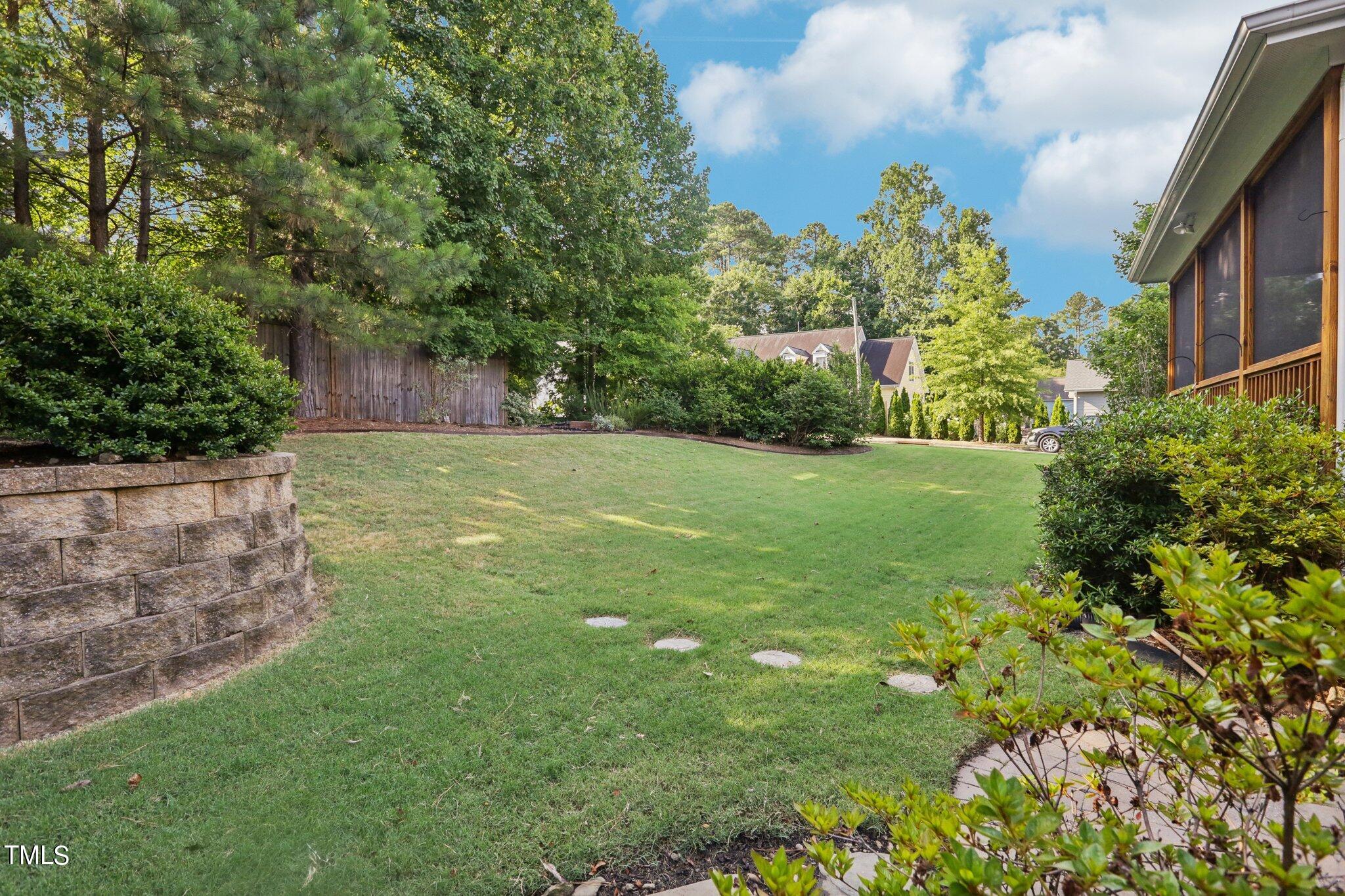 517 Plainview Avenue Raleigh, NC 27604 - Photo 50 of 58 a view of a backyard with plants and large trees