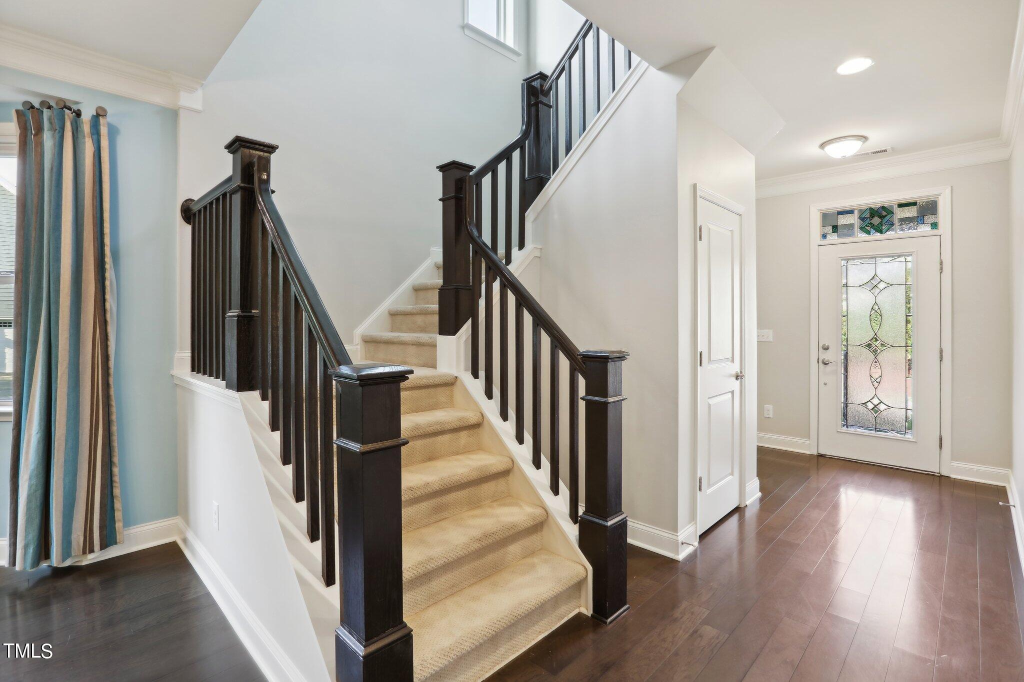 517 Plainview Avenue Raleigh, NC 27604 - Photo 5 of 58 a view of an entryway with wooden floor and stairs
