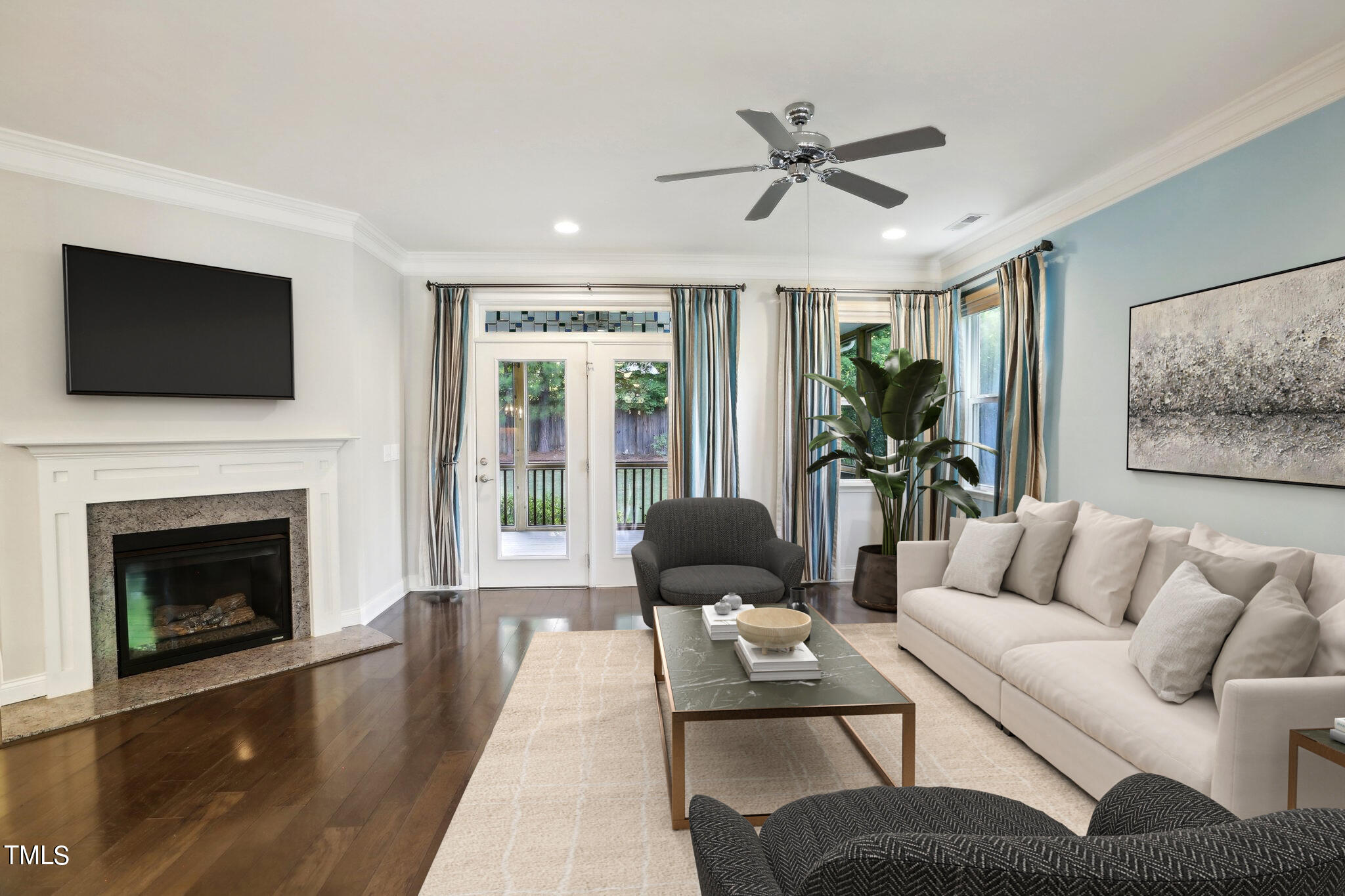 517 Plainview Avenue Raleigh, NC 27604 - Photo 6 of 58 a living room with furniture a flat screen tv and a fireplace