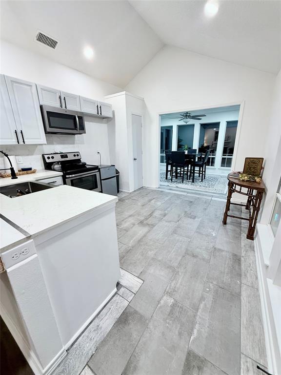188 Candlelight Path Hawkins, TX 75765 - Photo 16 of 25 a view of kitchen with furniture and wooden floor
