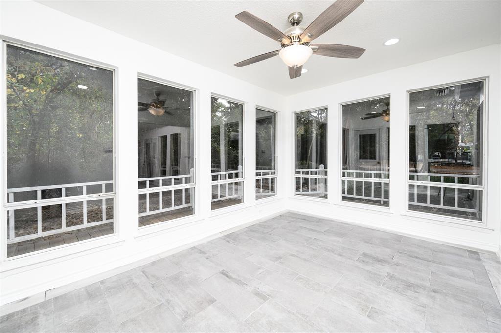 188 Candlelight Path Hawkins, TX 75765 - Photo 18 of 25 a view of an empty room with a window and a ceiling fan