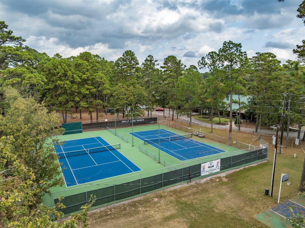 188 Candlelight Path Hawkins, TX 75765 - Photo 23 of 25 a view of a tennis ground with large trees