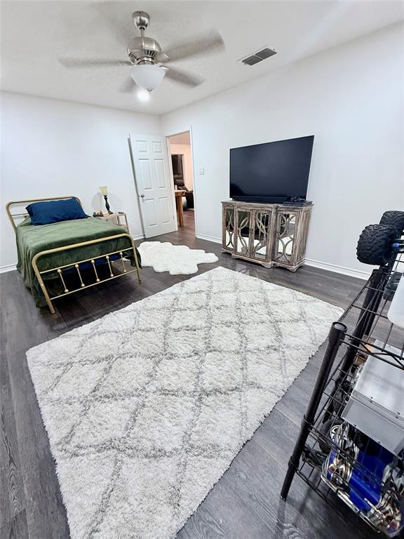 188 Candlelight Path Hawkins, TX 75765 - Photo 3 of 25 a bedroom with furniture and a flat screen tv