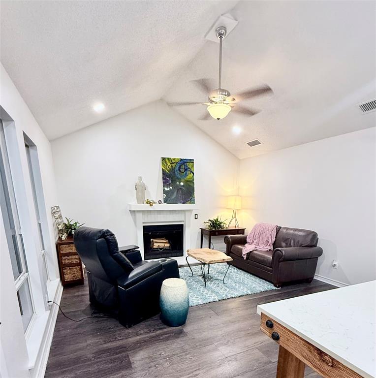 188 Candlelight Path Hawkins, TX 75765 - Photo 4 of 25 a living room with furniture and a fireplace