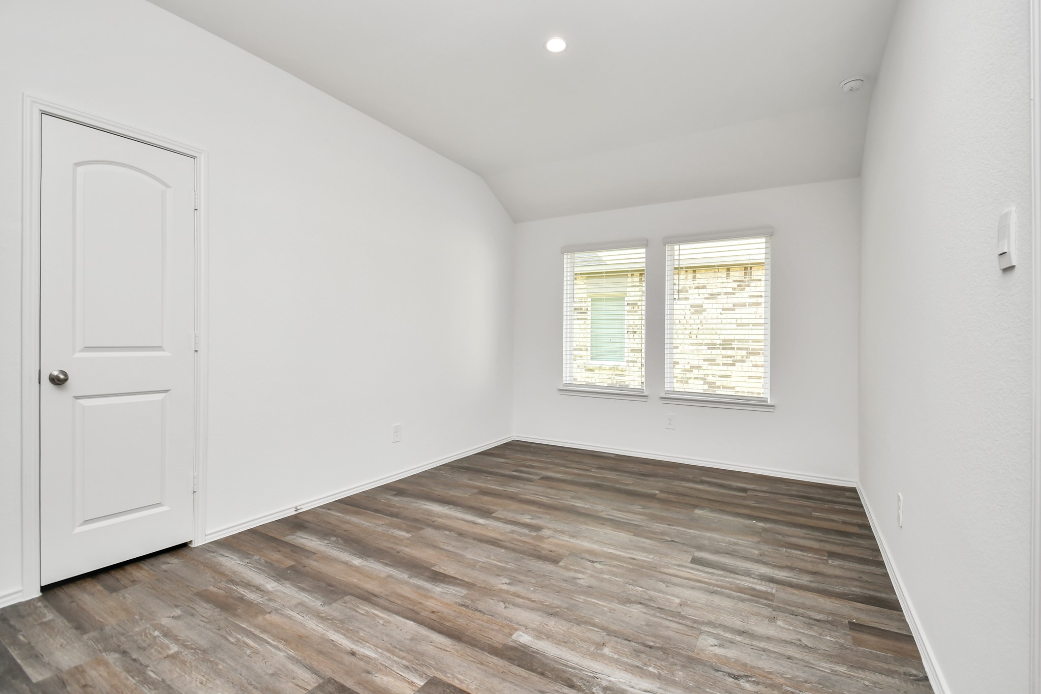 5315 Castlebury Meadows Dr Spring Spring, TX 77373 - Photo 15 of 39 an empty room with wooden floor and windows