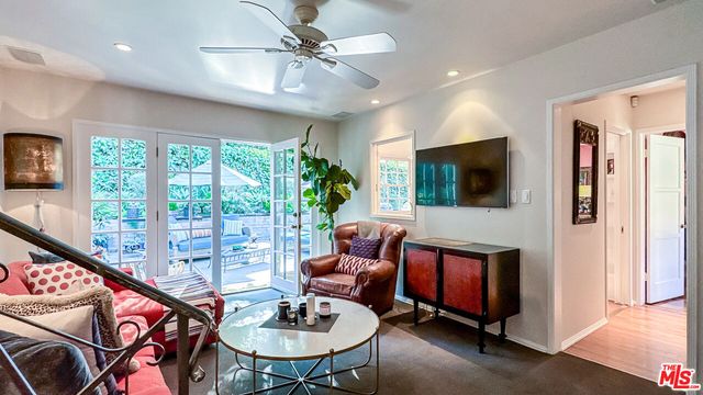 a living room with furniture fireplace and a flat screen tv
