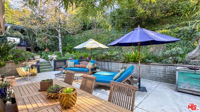 a view of patio with furniture