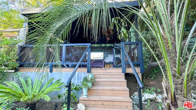 a view of entryway with flower plants