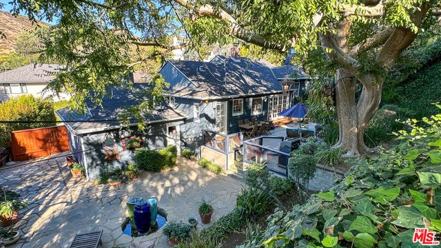an aerial view of a house with a garden