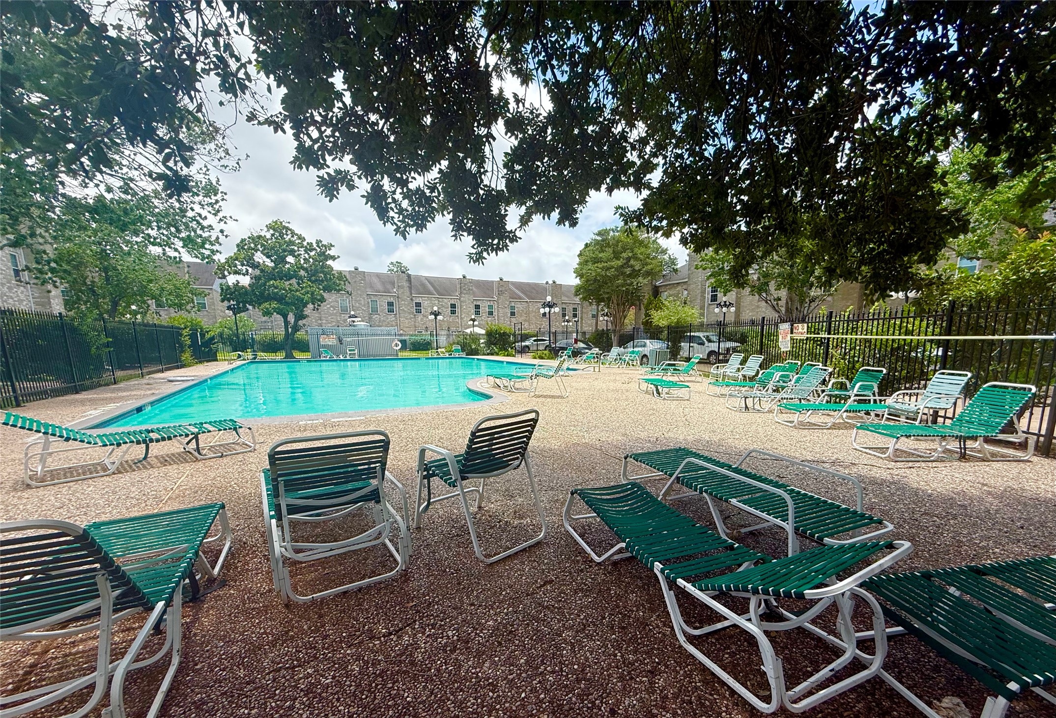 6000 Reims Road, Unit 3010 Houston, TX 77036 - Photo 25 of 28 Swimming pool with shaded trees