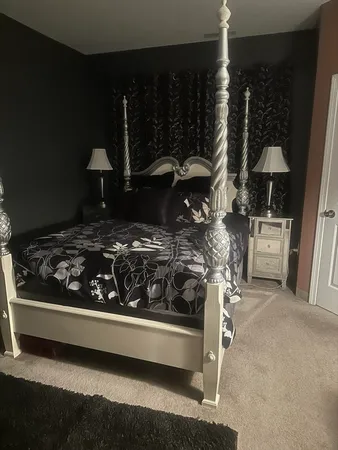 a kitchen with a stove and a wooden table