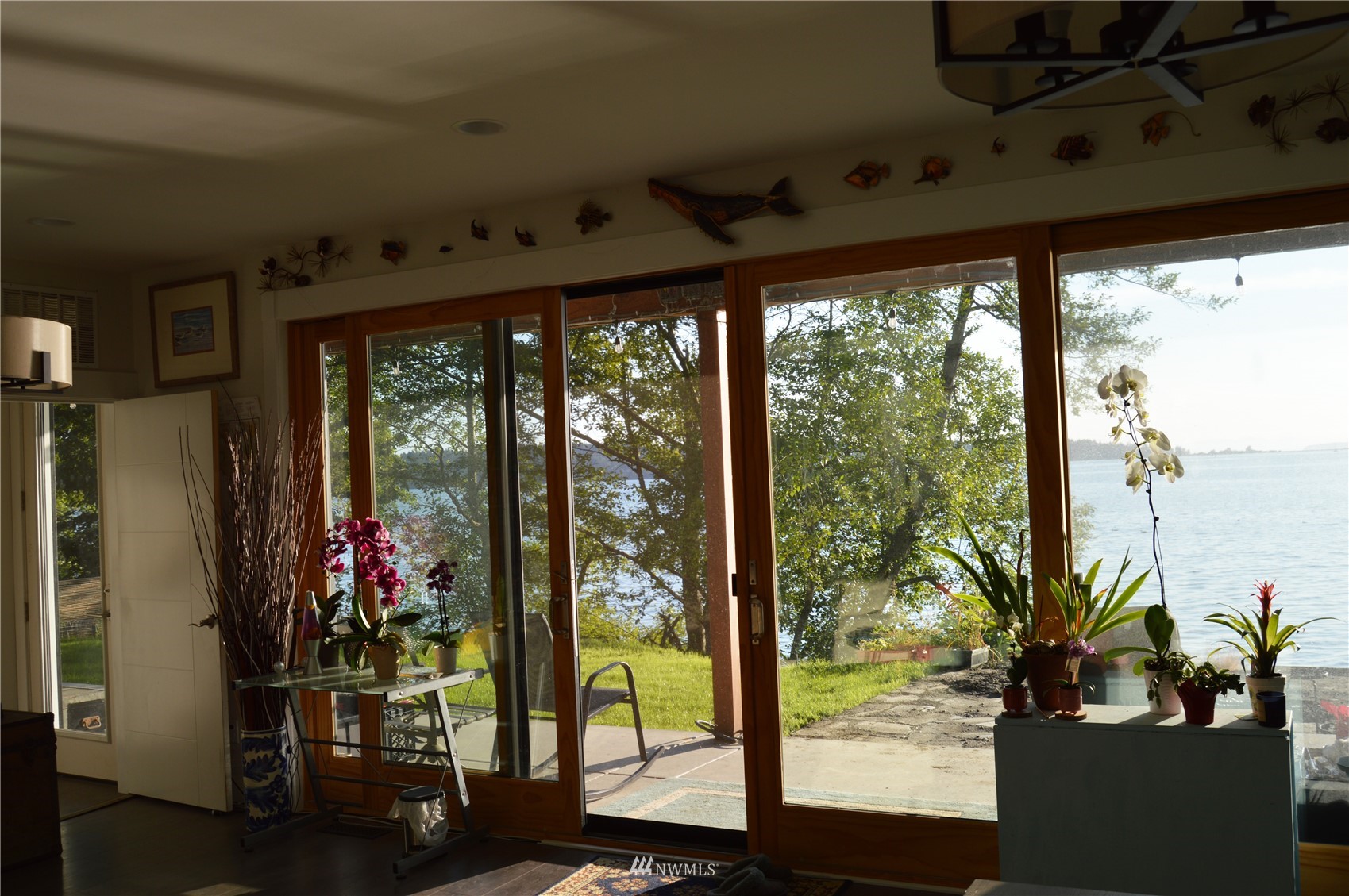920 Ruby Street Blaine, WA 98230 - Photo 15 of 40 a view of a porch with a floor to ceiling window and wooden floor