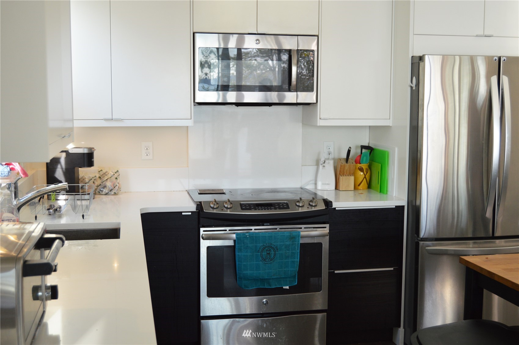 920 Ruby Street Blaine, WA 98230 - Photo 17 of 40 a kitchen with stainless steel appliances granite countertop a refrigerator sink and stove