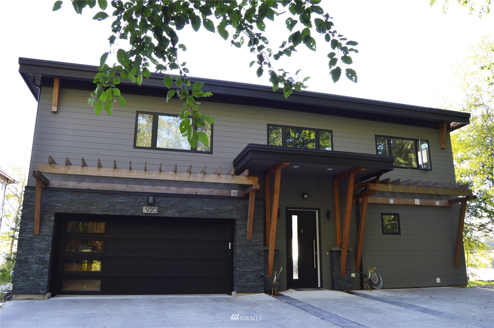 920 Ruby Street Blaine, WA 98230 - Photo 2 of 40 a view of a house with large windows and a fireplace