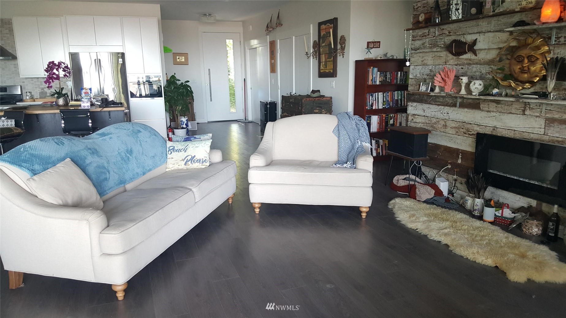920 Ruby Street Blaine, WA 98230 - Photo 5 of 40 a living room with furniture a flat screen tv and a fireplace