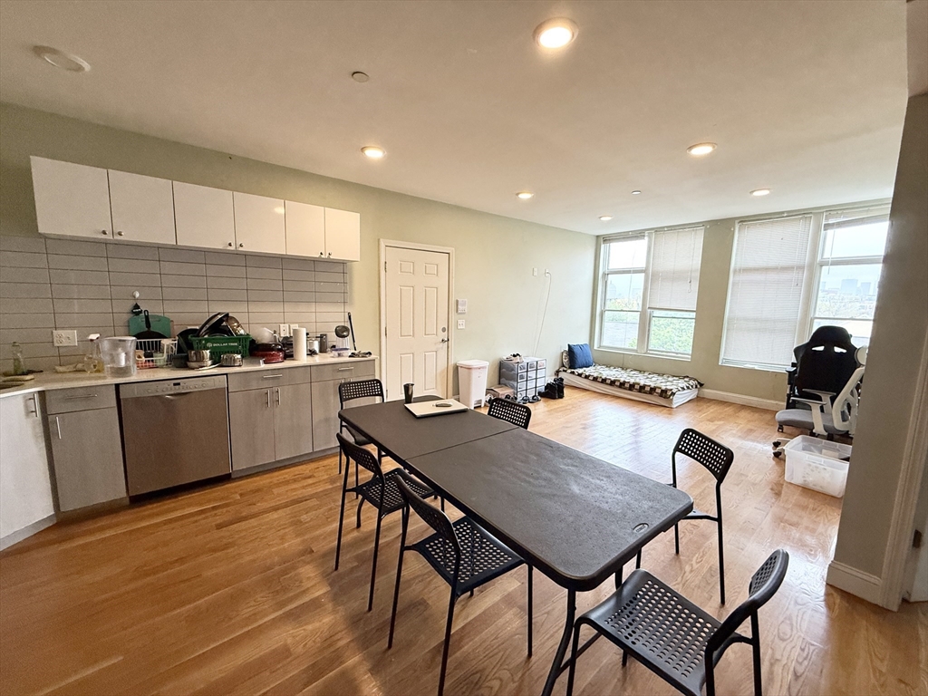 299 Dudley Street, Unit 8 Boston, MA 02119 - Photo 2 of 9 a view of kitchen with cabinets table and chairs