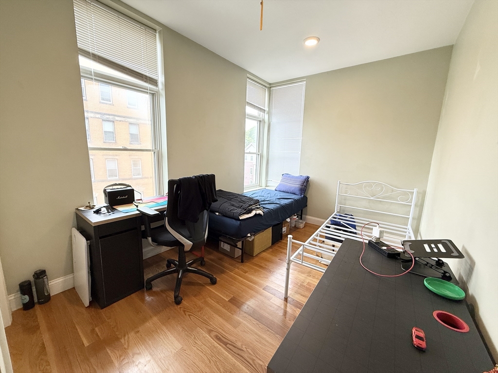 299 Dudley Street, Unit 8 Boston, MA 02119 - Photo 4 of 9 a view of a workspace with furniture and a window