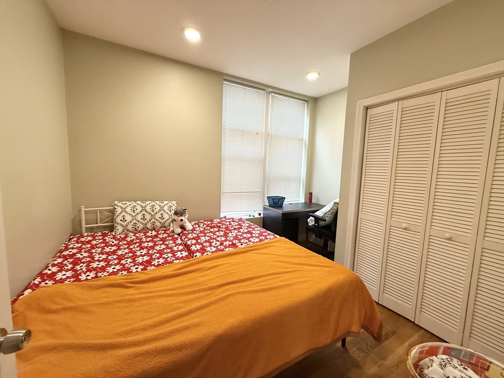 299 Dudley Street, Unit 8 Boston, MA 02119 - Photo 5 of 9 a bedroom with a bed and a window